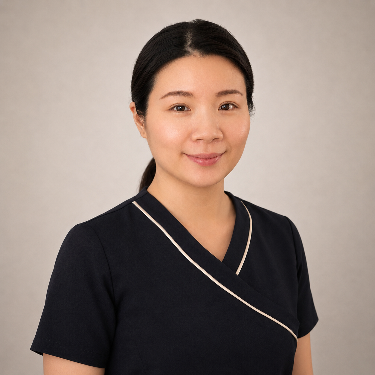 Sandy, certified Kogao practitioner, in a warm professional setting